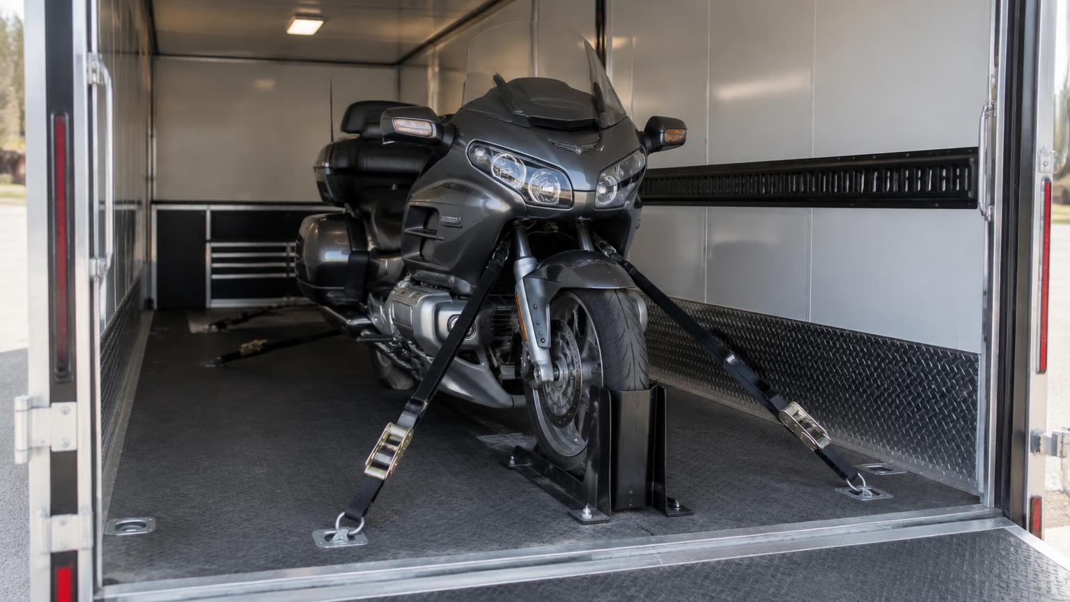Motorcycle secured inside a transport trailer